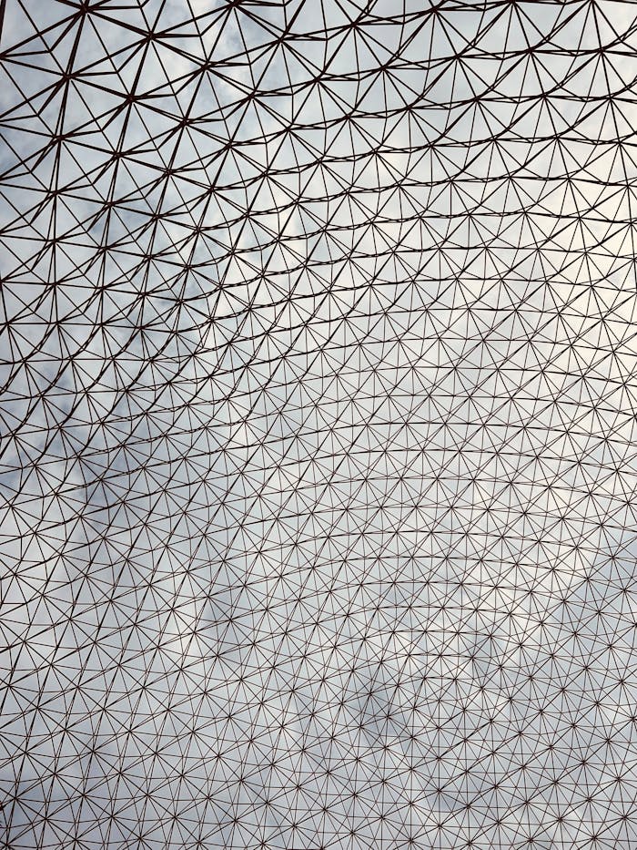 services-01 Intricate geometric pattern on a modern glass dome ceiling showcasing architectural elegance.